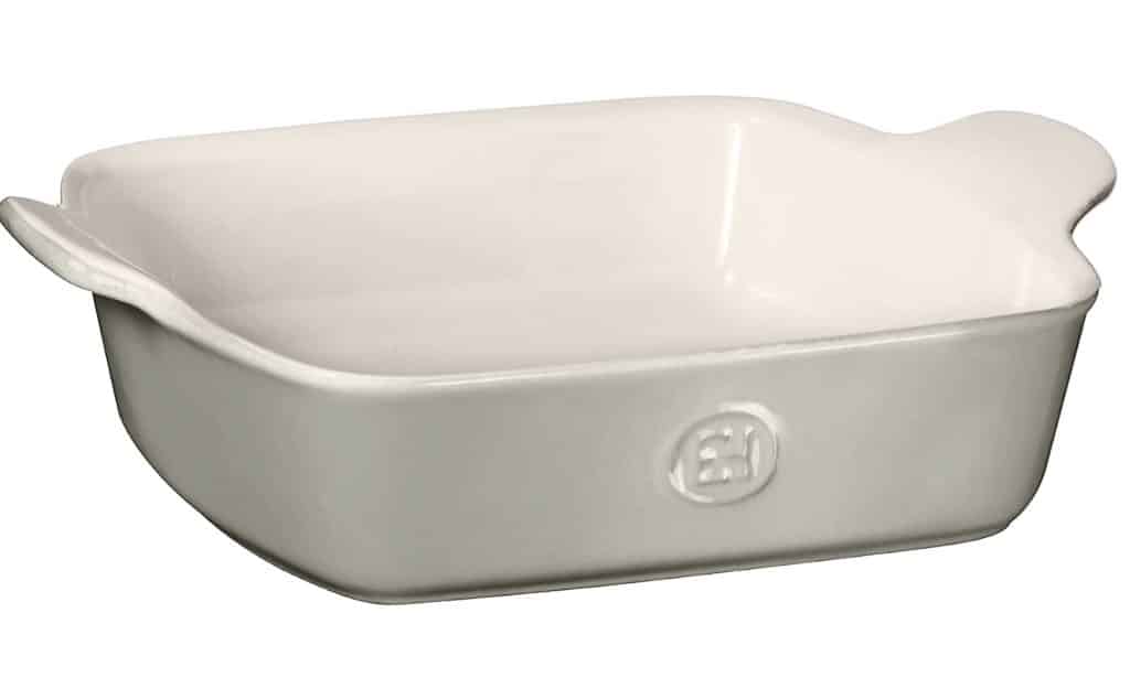 A white rectangular ceramic baking dish with handles on both sides, slightly raised edges, and an embossed logo on the front—perfect for serving instant pot mashed potatoes.